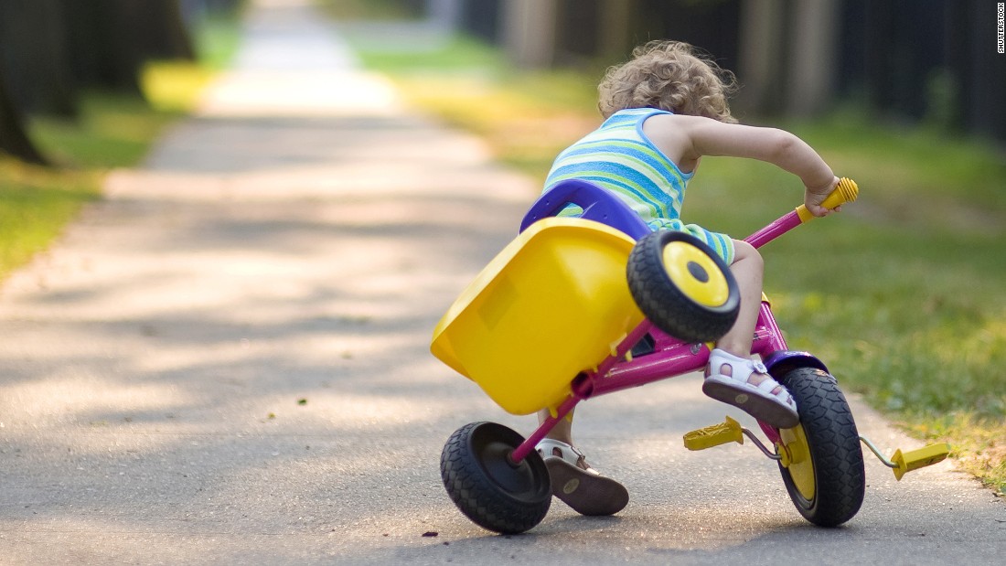 Child falling off tricycle